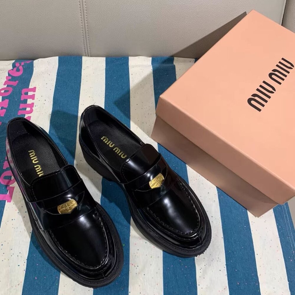 Women's Miu Miu black loafers